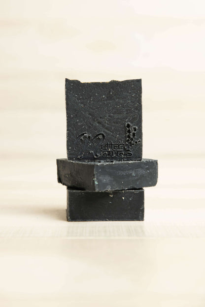 Handcrafted Dark Night bar soap with birchwood and tobacco scent notes
